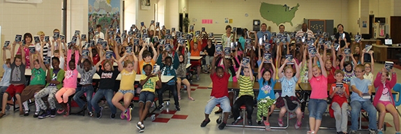 Irwin County 3rd graders holding up dictionaries