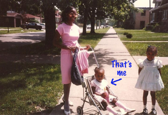Ashley as a baby in a stroller