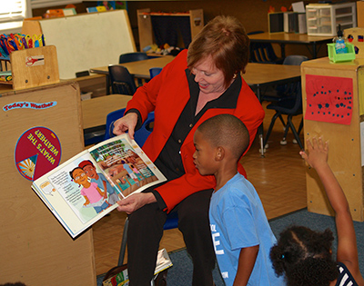 DPH Commissioner Brenda Fitzgerald reads to pre-k students at The Bridge Learning Center in Carrollton.