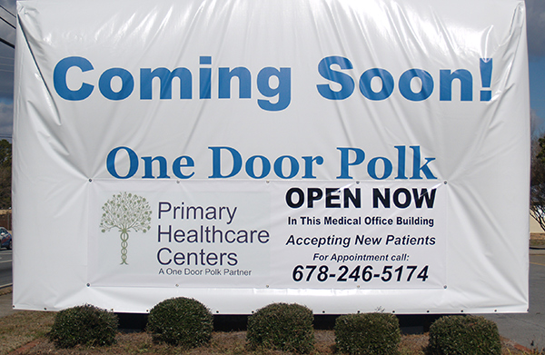 Sign: Coming Soon: One Door Polk
